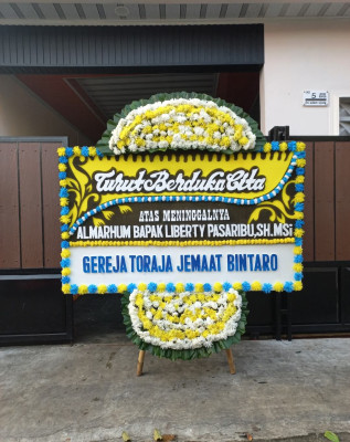 Papan Bunga Duka di Merak